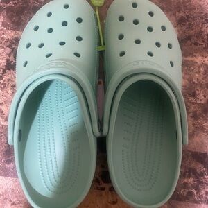 light blue crocs.